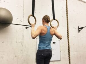 gymnastic ring pull up in a crossfit box