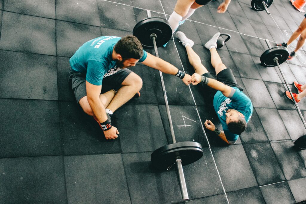 Crossfit people congratulate themselves for finishing the workout